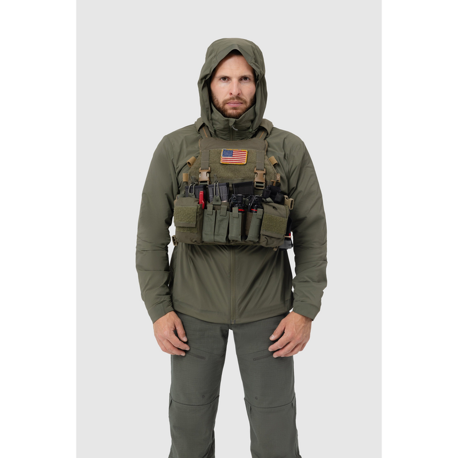 Frontal photo of the Tomahawk Performance Crosswind Jacket, a tactical windbreaker, worn under a carrier in Ranger Green color way.