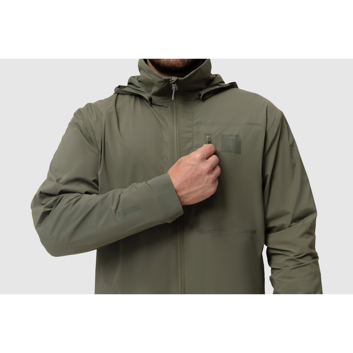 Front close-up photo of the Tomahawk Performance Crosswind Jacket, a tactical windbreaker, depicting the chest pocket and attachment point in Ranger Green color way.