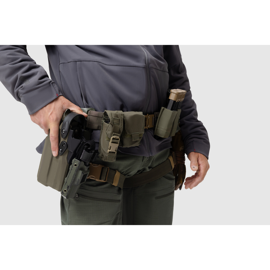 Close-up photo of the Tomahawk Performance Instructor Jacket, a cold weather insulated tactical jacket, worn under a duty belt.