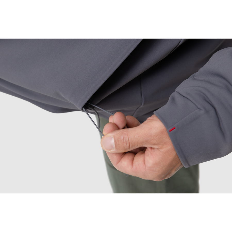 Close-up photo of the drawstring for the adjustable hem of the Tomahawk Performance Instructor Jacket.