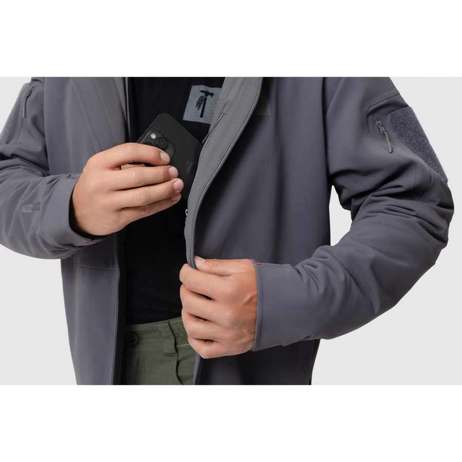 Close-up photo of the Tomahawk Performance Instructor Jacket's interior lining zippered stash pocket.