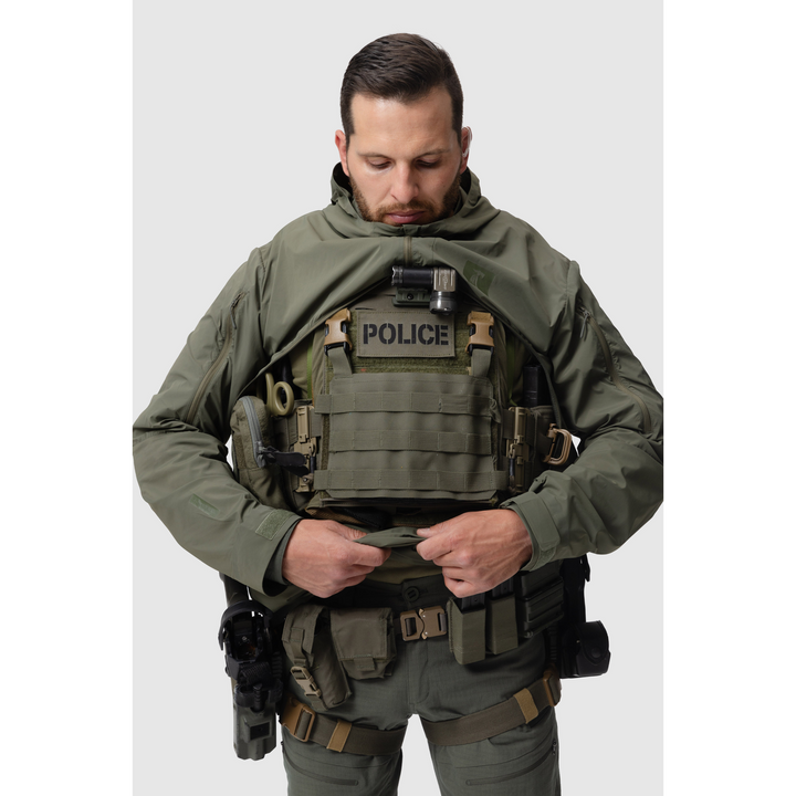 Frontal photo of the Tomahawk Performance Overlayer Anorak, tactical urban or military use weather protective layer, in the Ranger Green color way. Reverse-U zip is shown open to access a carrier.
