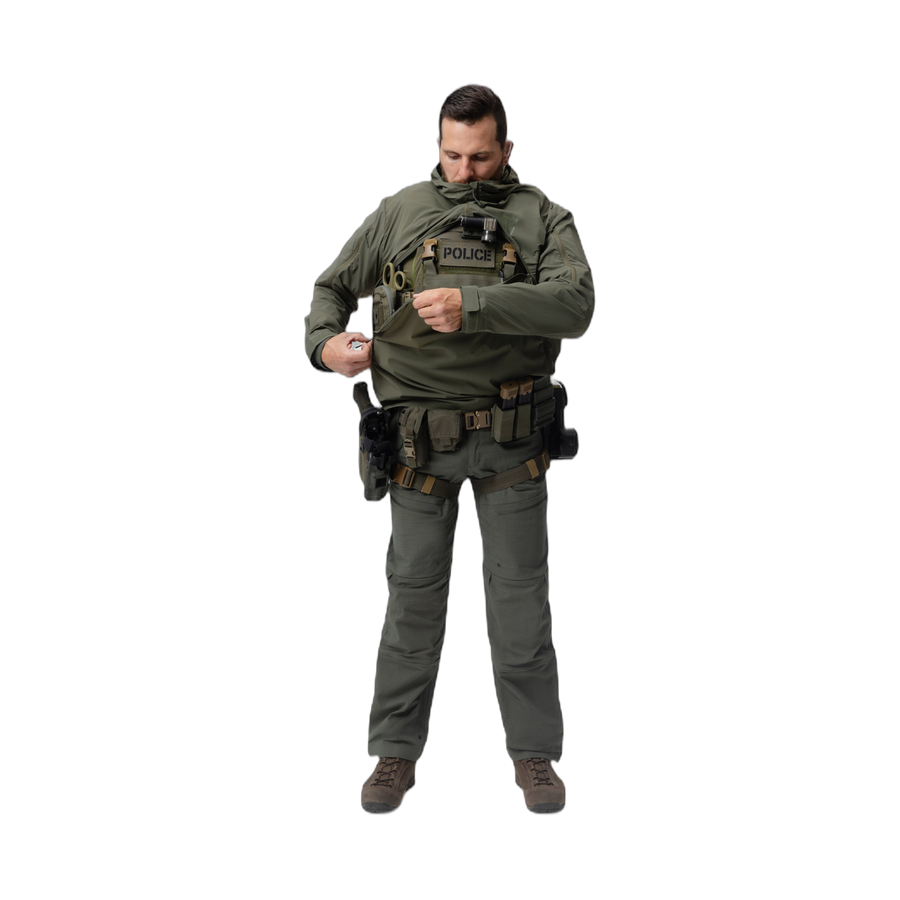 Frontal photo of the Tomahawk Performance Overlayer Anorak, tactical urban or military use weather protective layer, in the Ranger Green color way. Reverse-U zip shown being closed over a carrier.
