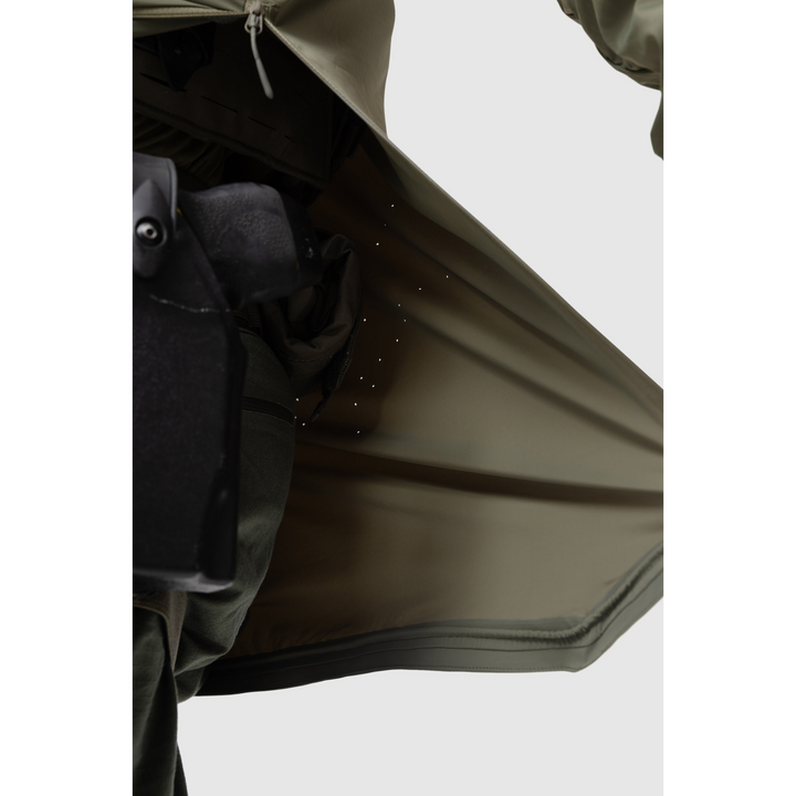 Close-up photo of the Tomahawk Performance Overlayer Anorak's interior lining featuring laser perforated panels for ventilation in Ranger Green color way.