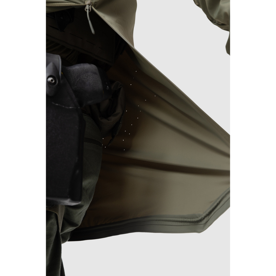 Close-up photo of the Tomahawk Performance Overlayer Anorak's interior lining featuring laser perforated panels for ventilation in Ranger Green color way.