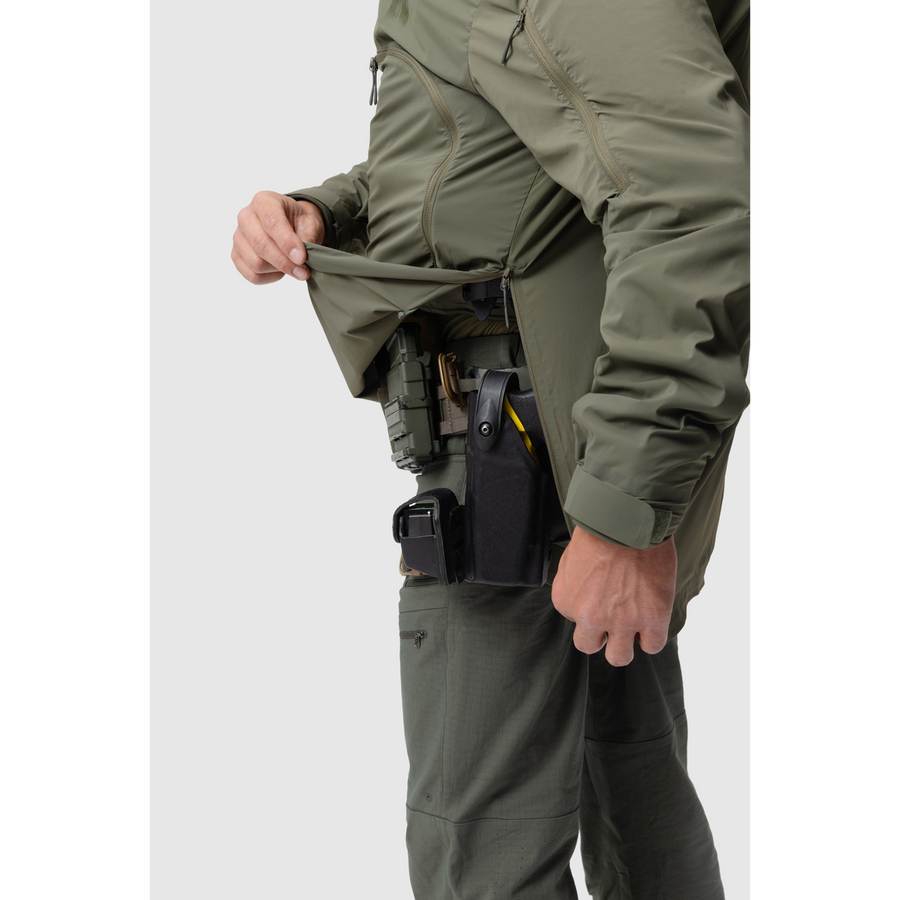 Close-up photo of the photo of the Tomahawk Performance Overlayer Anorak in Ranger Green's side zippered opening for easy donning and doffing.